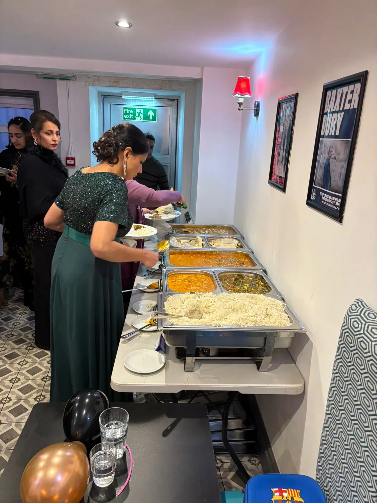 Bombay 2 Goa team serving a hot buffet line at a catered event